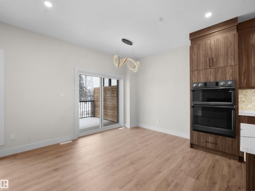 Unfurnished dining area with light wood-type flooring, a chandelier, and recessed lighting - 46 Waverly Way, Fort Saskatchewan, AB - Indoor