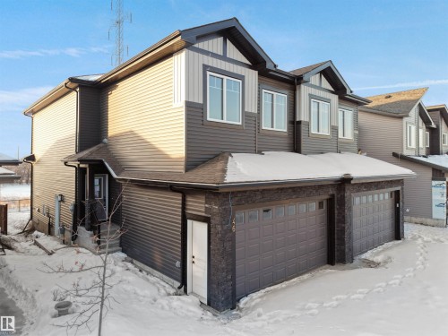 View of front of home featuring a garage and board and batten siding - 46 Waverly Way, Fort Saskatchewan, AB - Outdoor