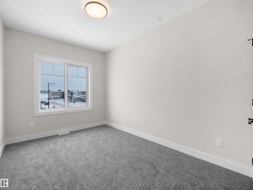 Empty room featuring baseboards and carpet floors - 46 Waverly Way, Fort Saskatchewan, AB - Indoor Photo Showing Other Room