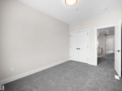 Unfurnished bedroom with carpet and a closet - 46 Waverly Way, Fort Saskatchewan, AB - Indoor Photo Showing Other Room