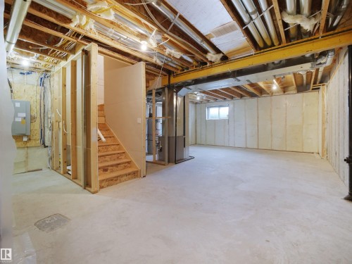 Below grade area with heating unit and stairs - 46 Waverly Way, Fort Saskatchewan, AB - Indoor Photo Showing Basement