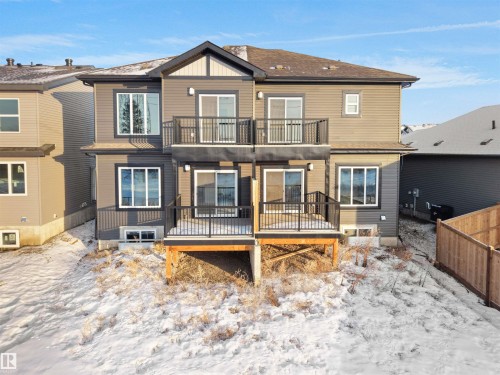 Snow covered house featuring a balcony - 46 Waverly Way, Fort Saskatchewan, AB - Outdoor With Deck Patio Veranda