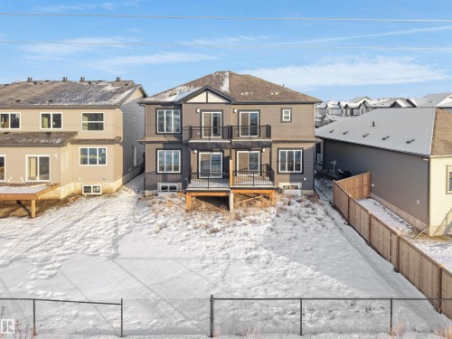 Snow covered property featuring a deck and a residential view - 46 Waverly Way, Fort Saskatchewan, AB - Outdoor