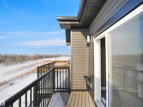 View of snow covered back of property - 46 Waverly Way, Fort Saskatchewan, AB - Outdoor With Exterior