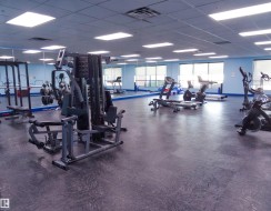 Gym featuring a drop ceiling - 