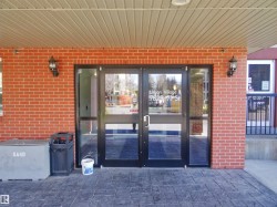 Doorway to property with brick siding and french doors - 