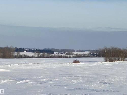 View of yard layered in snow - Twp 550 Rr 211, Rural Strathcona County, AB 