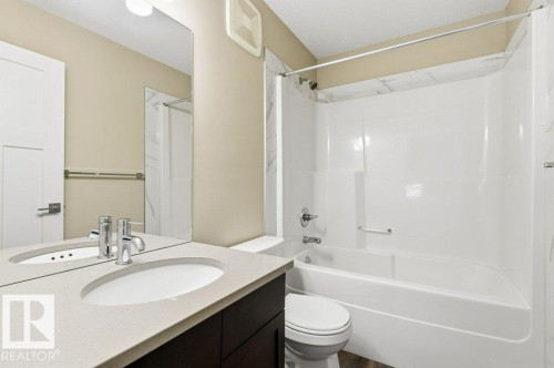 Bathroom with vanity and bathtub / shower combination - 2 Wingate Way, Fort Saskatchewan, AB - Indoor Photo Showing Bathroom