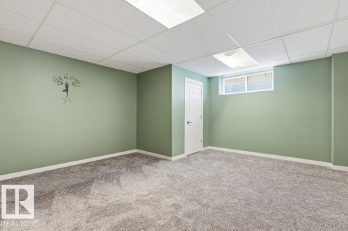 Basement with carpet and a paneled ceiling - 2 Wingate Way, Fort Saskatchewan, AB - Indoor