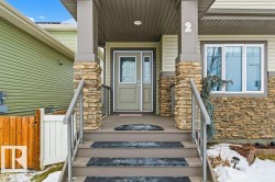 Property entrance featuring stone siding - 