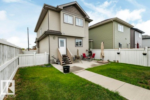 Back of house with a fenced backyard and entry steps - 2 Wingate Way, Fort Saskatchewan, AB - Outdoor