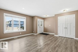 Foyer featuring baseboards and light wood-style flooring - 