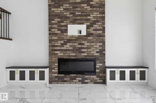 228 36 St Sw, Edmonton, AB - Indoor Photo Showing Other Room With Fireplace