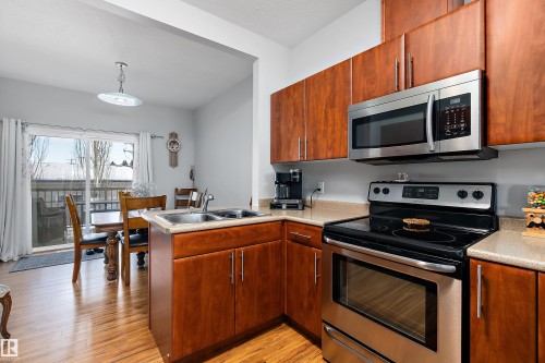2 300 Queen Street, Spruce Grove, AB - Indoor Photo Showing Kitchen With Double Sink
