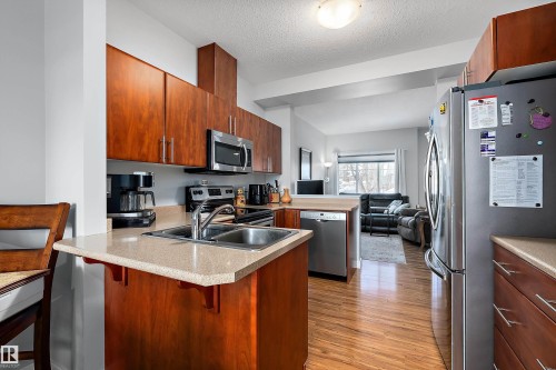 2 300 Queen Street, Spruce Grove, AB - Indoor Photo Showing Kitchen With Double Sink