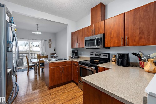 2 300 Queen Street, Spruce Grove, AB - Indoor Photo Showing Kitchen With Double Sink