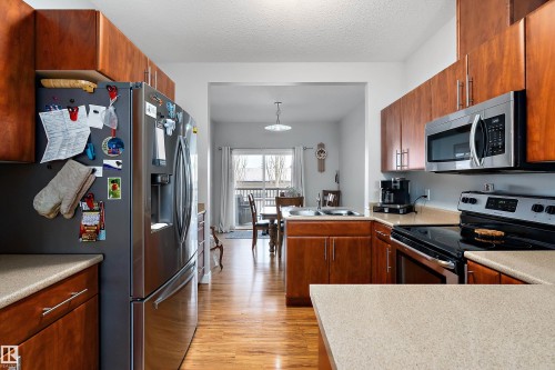 2 300 Queen Street, Spruce Grove, AB - Indoor Photo Showing Kitchen With Double Sink