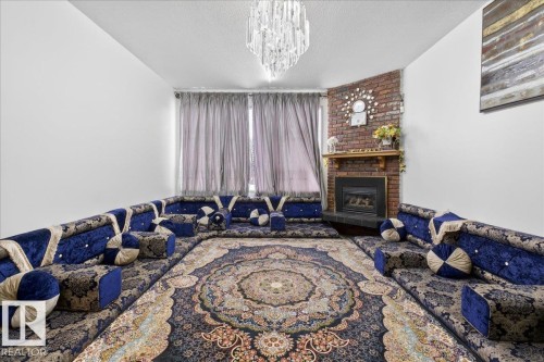 14920 95A Street, Edmonton, AB - Indoor Photo Showing Bedroom With Fireplace