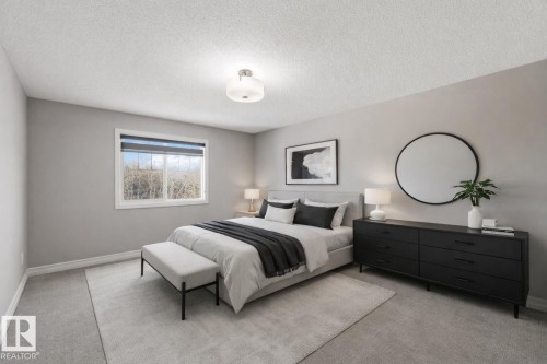 Bedroom with carpet and a textured ceiling - 3683 8 Street, Edmonton, AB - Indoor Photo Showing Bedroom