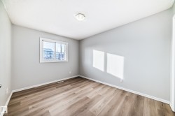 Spare room with light wood-style flooring and baseboards - 
