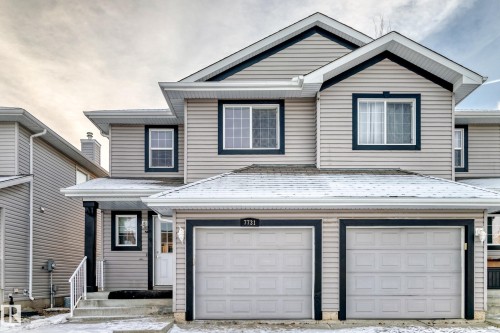 Traditional-style home with an attached garage and driveway - 7731 8 Avenue, Edmonton, AB - Outdoor With Exterior
