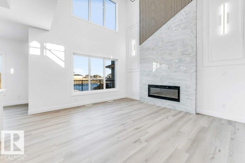 2408 63 Avenue, Rural Leduc County, AB - Indoor Photo Showing Living Room With Fireplace
