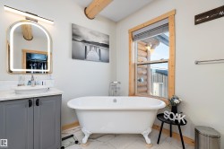 Full bathroom with vanity and a freestanding bath - 