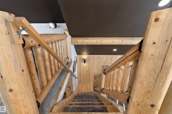 Stairs featuring wooden walls and recessed lighting - 