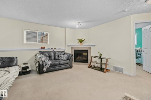 613 83 Street, Edmonton, AB - Indoor Photo Showing Living Room With Fireplace