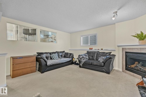 613 83 Street, Edmonton, AB - Indoor Photo Showing Living Room With Fireplace