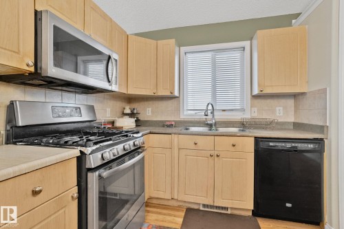 613 83 Street, Edmonton, AB - Indoor Photo Showing Kitchen With Double Sink