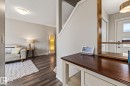 Foyer featuring a textured ceiling and dark wood-style flooring - 20110 27 Avenue, Edmonton, AB  - Indoor 