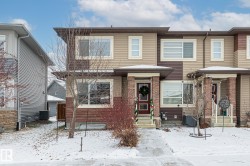 View of front of house with brick siding - 