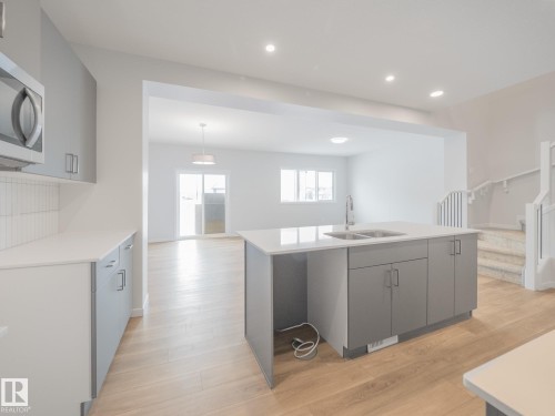 4631 Kinsella Landing, Edmonton, AB - Indoor Photo Showing Kitchen With Double Sink