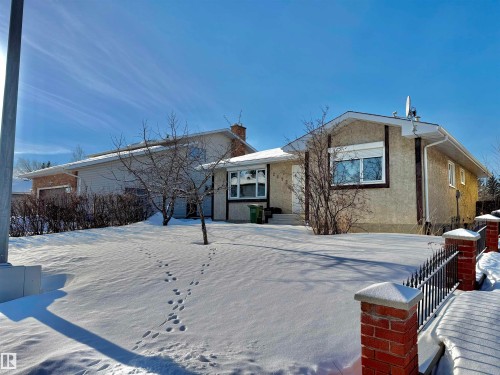 View of front of home with stucco siding and a chimney - 2112 104B Street, Edmonton, AB - Outdoor