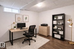 Home office featuring dark wood finished floors - 