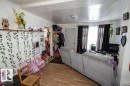 Living area featuring wood finished floors - 4922 47 Ave, St. Paul Town, AB  - Indoor Photo Showing Other Room 