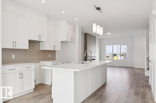 245 Wattle Road, Leduc, AB - Indoor Photo Showing Kitchen With Upgraded Kitchen