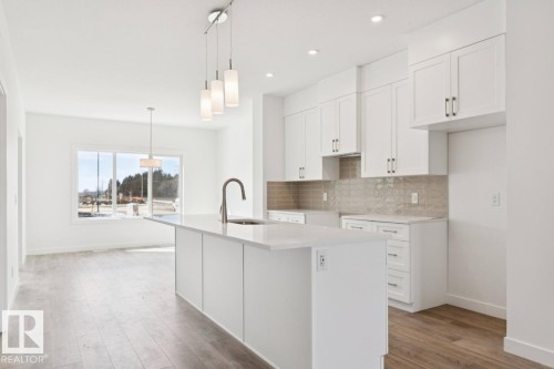 245 Wattle Road, Leduc, AB - Indoor Photo Showing Kitchen With Upgraded Kitchen