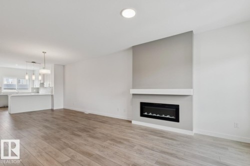 205 Wattle Road, Leduc, AB - Indoor Photo Showing Living Room With Fireplace