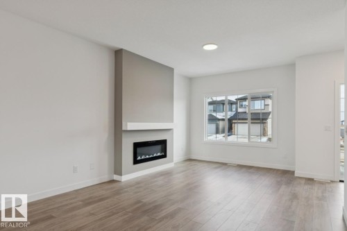 205 Wattle Road, Leduc, AB - Indoor Photo Showing Living Room With Fireplace