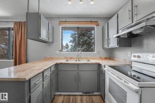 6411 12 Avenue, Edmonton, AB - Indoor Photo Showing Kitchen With Double Sink