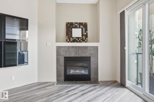 402 10235 112 Street, Edmonton, AB - Indoor Photo Showing Living Room With Fireplace