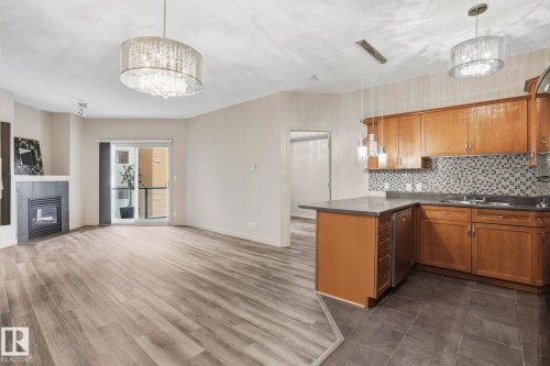 402 10235 112 Street, Edmonton, AB - Indoor Photo Showing Kitchen With Fireplace