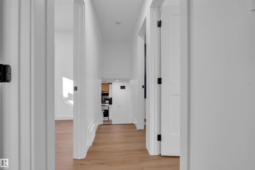 Hallway featuring light wood finished floors - 1111 49A Street, Edmonton, AB - Indoor Photo Showing Other Room