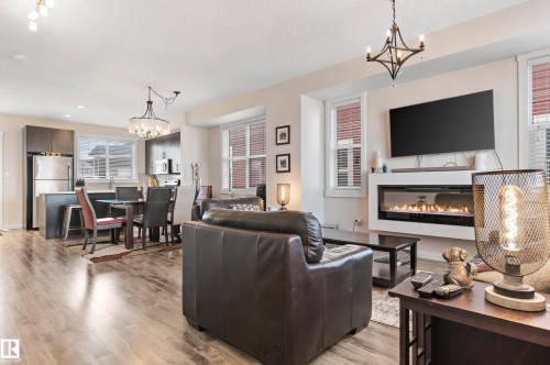 43 903 Crystallina Nera Way, Edmonton, AB - Indoor Photo Showing Living Room With Fireplace