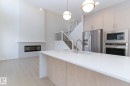 19004 20 Avenue, Edmonton, AB  - Indoor Photo Showing Kitchen With Fireplace With Upgraded Kitchen 