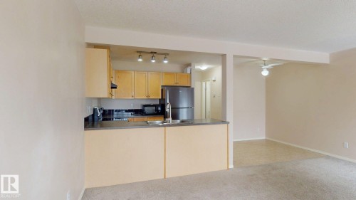 116 230 Edwards Drive, Edmonton, AB - Indoor Photo Showing Kitchen With Double Sink