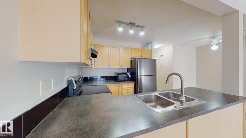 116 230 Edwards Drive, Edmonton, AB - Indoor Photo Showing Kitchen With Double Sink