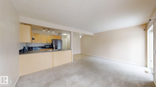 116 230 Edwards Drive, Edmonton, AB - Indoor Photo Showing Kitchen With Double Sink